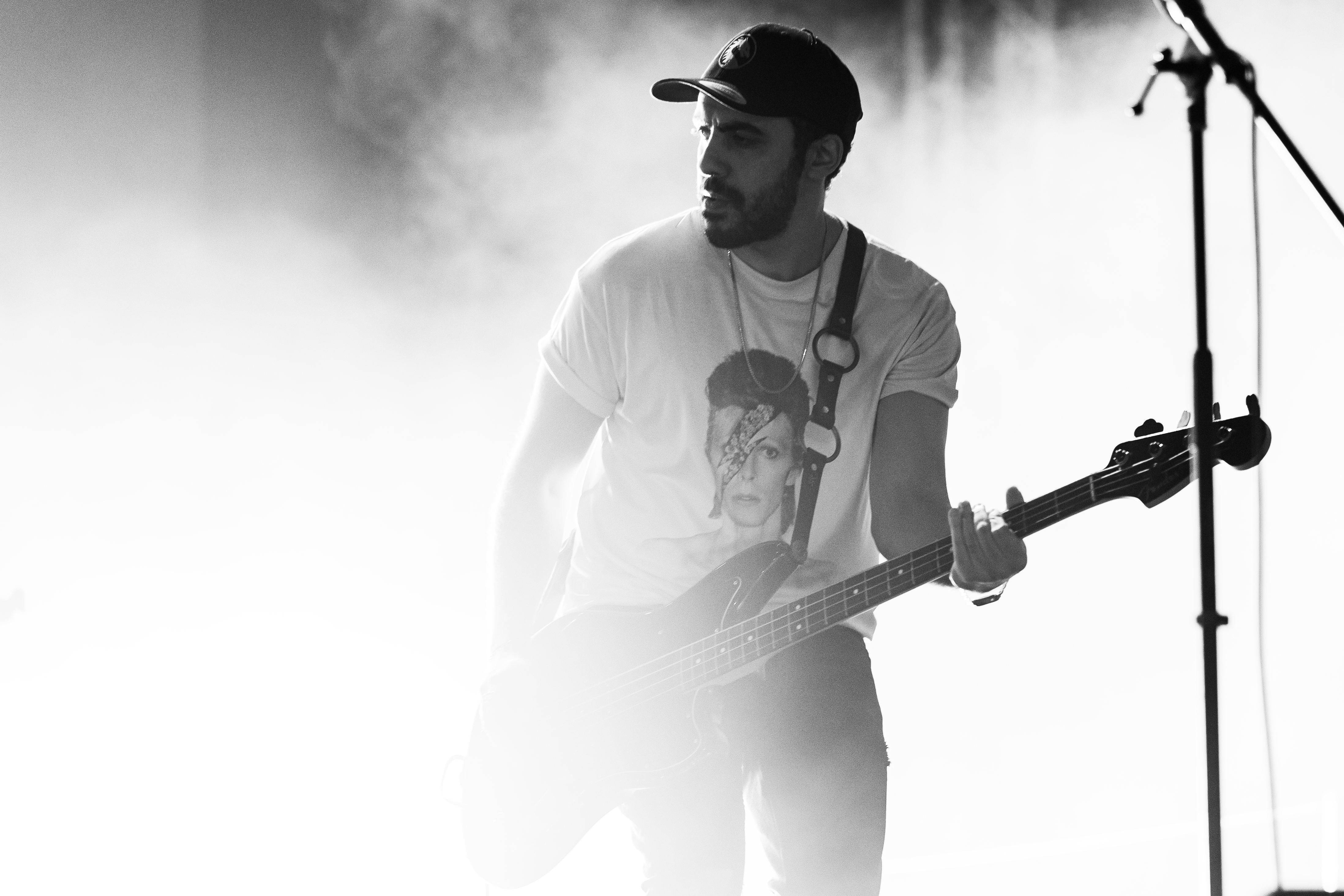 Frank Bassiouni playing bass on stage