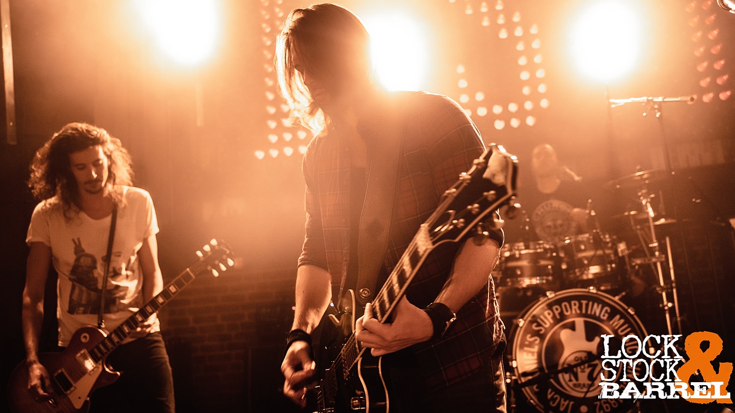 Gaz Hanford and Tristan Surina playing guitars together on stage