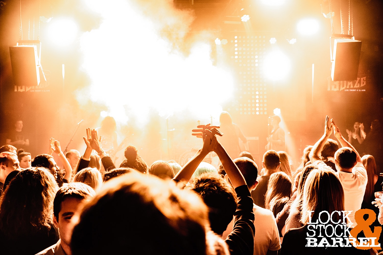 Crowd cheering at a 13 Daze live show